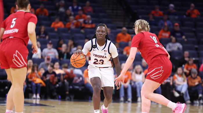 Alexia Smith dribbles the ball during the Virginia women's basketball game against Louisville at John Paul Jones Arena.